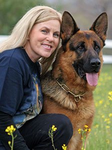 Diana Sparacino, owner of Diana's Dog Training & Boarding, with her German Shepherd